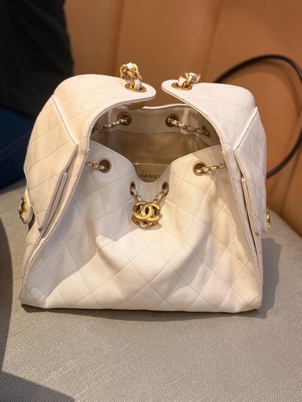 CHANEL Cream Quilted Drawstring Shoulder Bag with Gold CC Lock